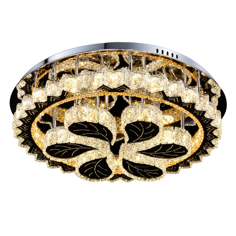 A round flush-mount ceiling light fixture with a silver chrome frame, featuring clear crystal-like glass panels and black floral enameled details that glow warm yellow.