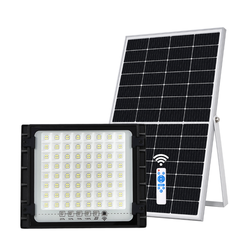 A solar-powered LED light fixture shown with its rectangular solar panel, white remote control, and black metal housing on a plain white background.