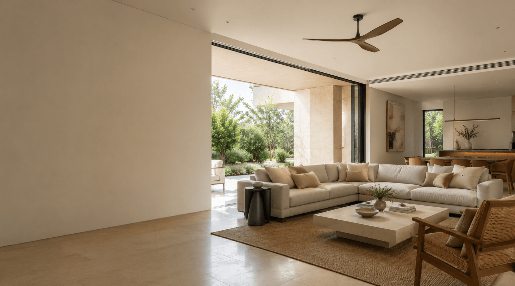 Modern living room with a sectional sofa, coffee table, and decorative items.